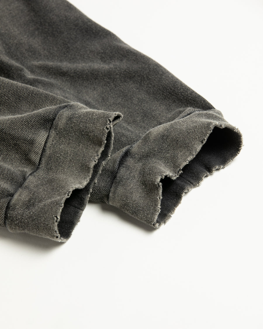 鹿の子生地を使用し硫化染サスティナブルブリーチ加工しダメージを加えた黒色のロングスリーブTシャツ