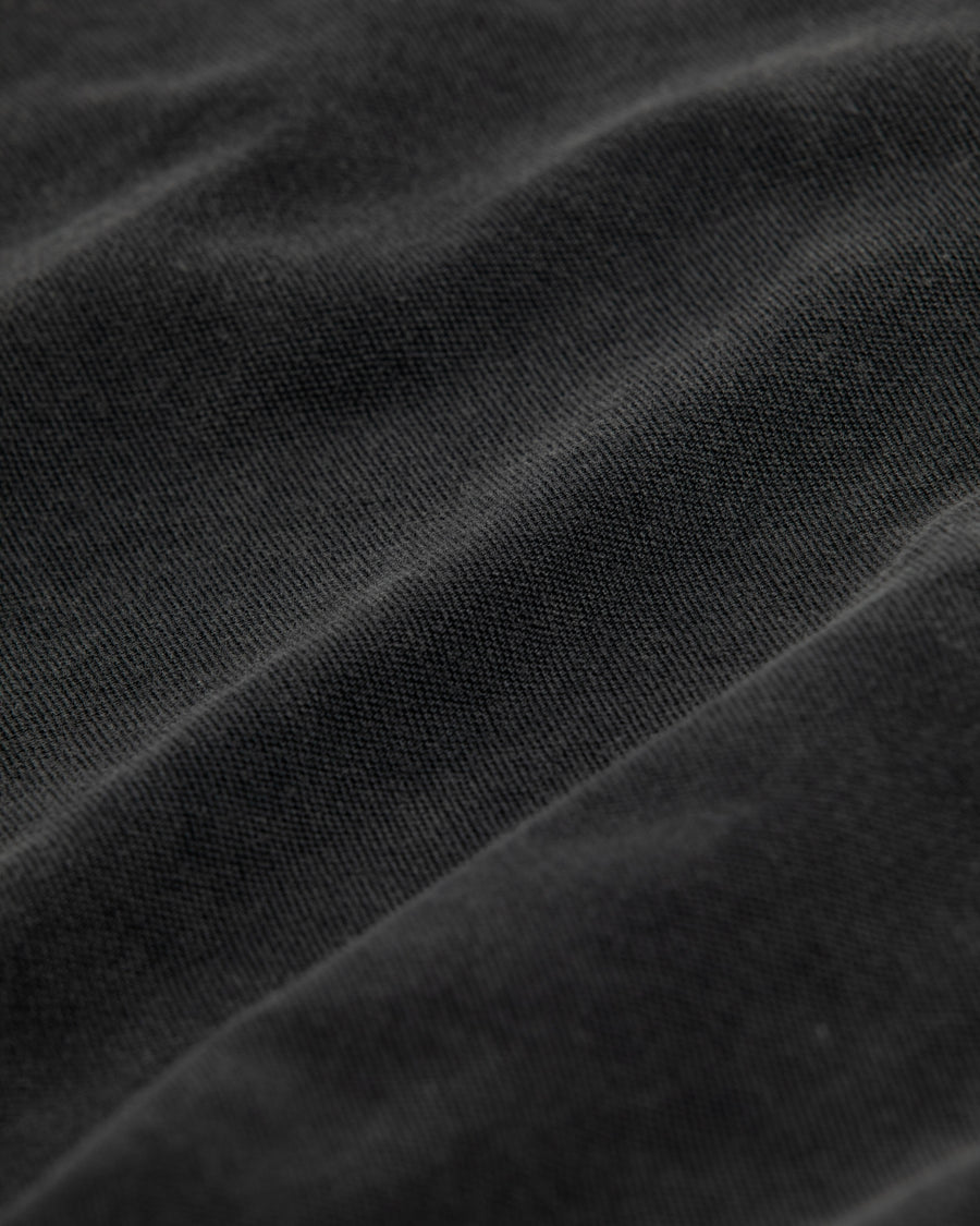 鹿の子生地を使用し硫化染サスティナブルブリーチ加工しダメージを加えた黒色のロングスリーブTシャツ