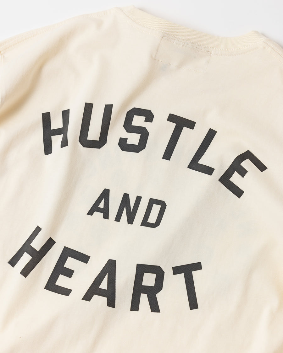 ANACHRONORM × Souvenyr NYC フェイシズ 半袖Tシャツ ベージュ | コラボグラフィック ニューヨーク コットン100%